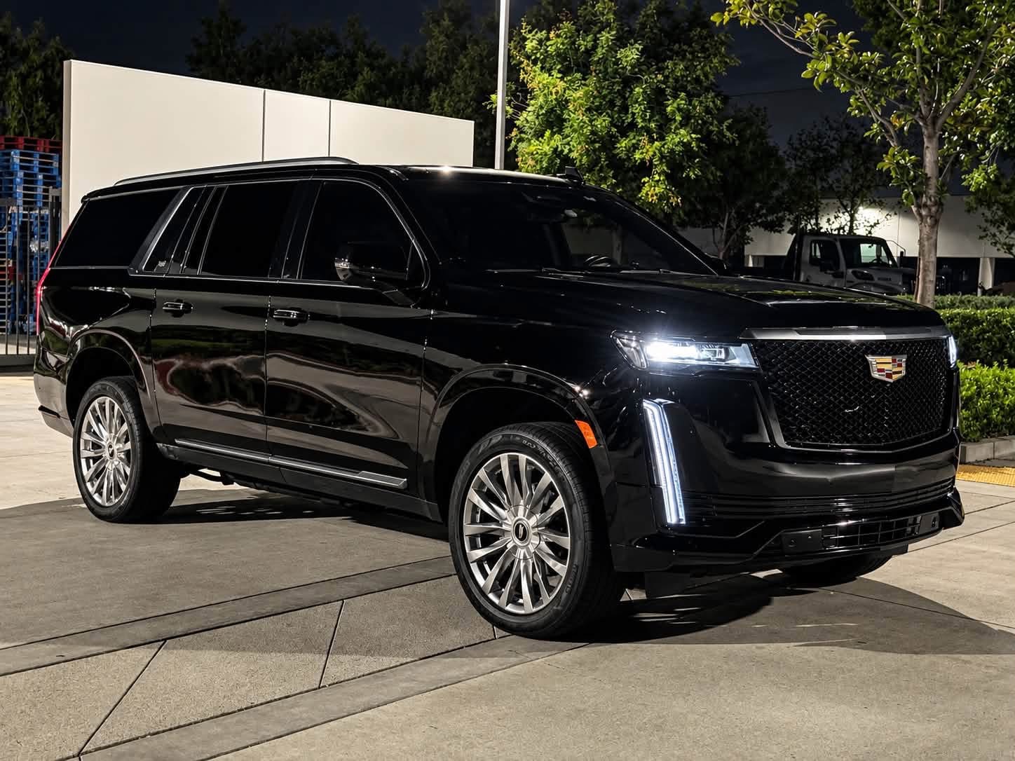 Black Cadillac at night, complete front and side view